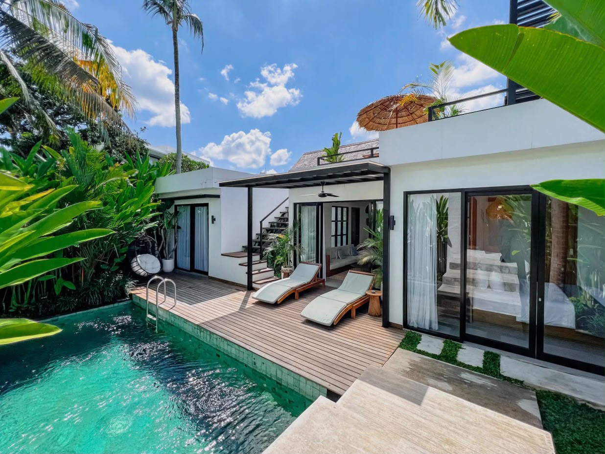 Two-storey tropical villa with private pool and timber deck in Munggu